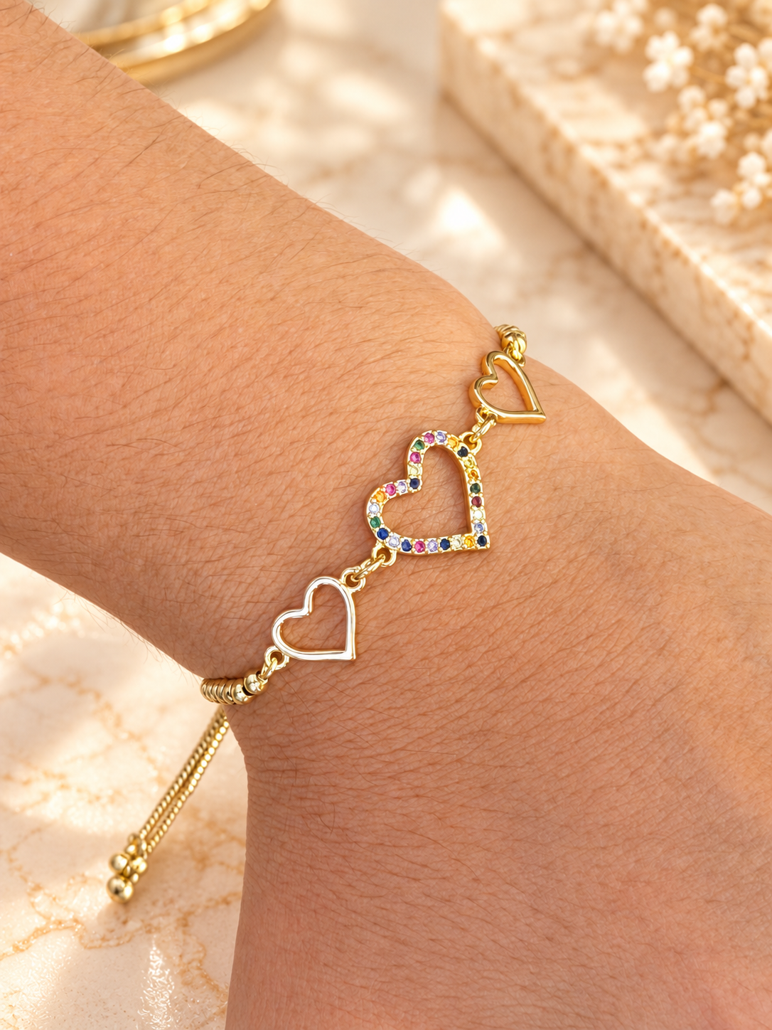 Pulsera triple corazón graduable